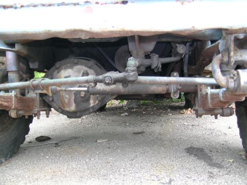 1950 Jeep CJ5 - Undercarriage view of a Jeep's drivetrain, showing leaf springs and differential components.