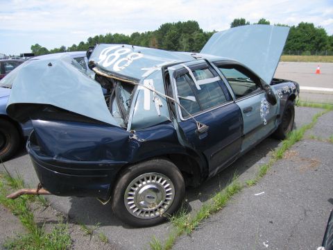 1991 Ford LTD Crown Victoria - This 1991 Ford Crown Victoria LTD shows extensive damage to its rear and roof structure.
