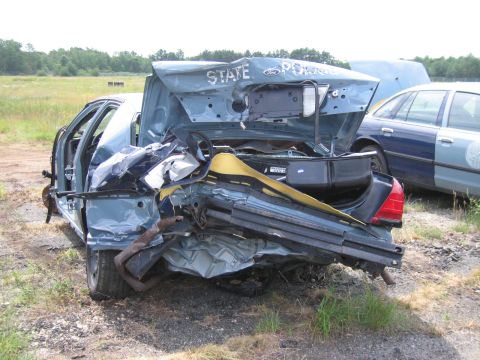 1991 Ford LTD Crown Victoria - Heavily damaged 1991 Ford Crown Victoria LTD police car shows extensive rear-end collision damage.