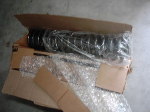 1978 Ford Bronco - New suspension parts are packaged for shipping inside a cardboard box.