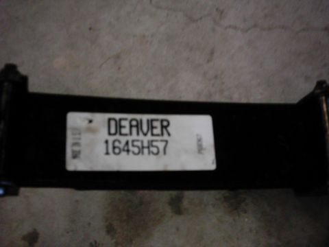 1978 Ford Bronco - A close-up view of a black metal part a white label with identifying text.