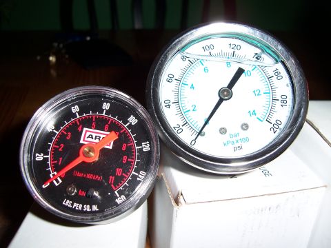 1983 Ford Bronco - Two pressure gauges are shown, one black and one white, with various pressure readings visible.