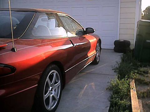 1996 Ford Probe - This 1996 Ford Probe is seen in a 3/4 front view, parked in front of a garage.