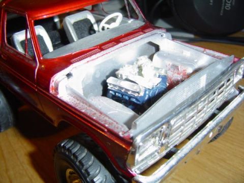 1979 Ford Bronco - A close-up view of a model truck's engine bay, the engine and interior details.
