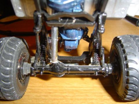 1979 Ford Bronco - Close-up of a model truck's chassis, suspension, and engine components.