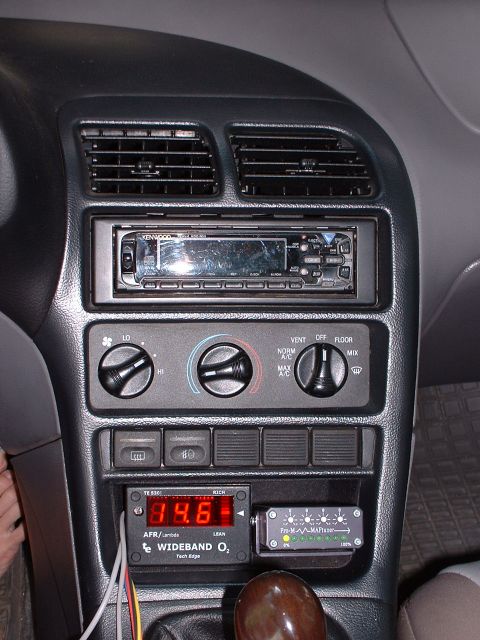 1996 Ford Probe - Aftermarket gauges, including a wideband O2 sensor and MAF controller, are installed on the dashboard of this vehicle.