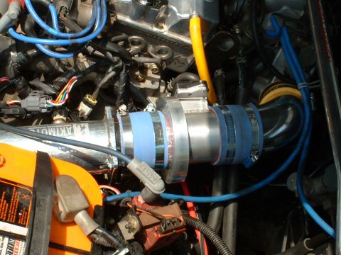 1996 Ford Probe - Aftermarket intake system installed in an engine bay, with a yellow battery in view.