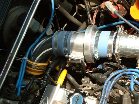 1996 Ford Probe - Modified engine bay with custom intake piping and blue hoses visible.