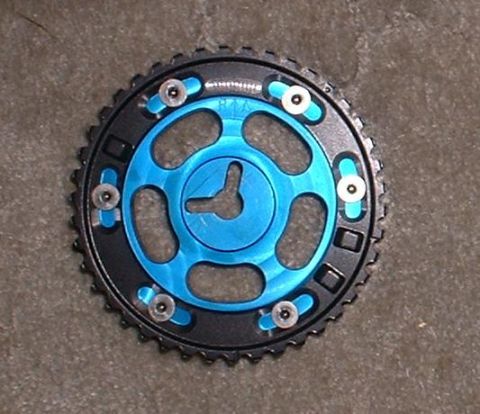 1996 Ford Probe - A close-up view of an adjustable camshaft gear, a component used in engine timing.