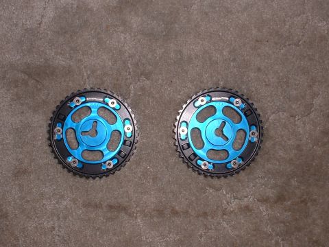 1996 Ford Probe - Pair of adjustable camshaft gears shown on a textured background.