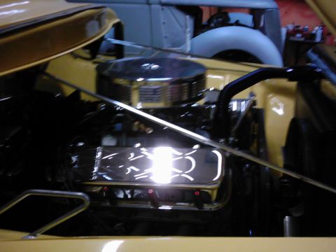 1978 Ford Bronco - Close-up of an engine bay with polished chrome valve covers and a round air cleaner.