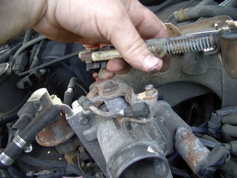1986 Ford Bronco - I had work to do taking off and cleaning the throttle body, IAC and EGR passageways. First off came the linkage cables