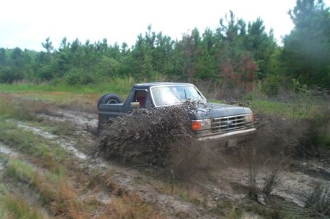1988 Ford Bronco - Ford Bronco stuck in mud during an off-road excursion.