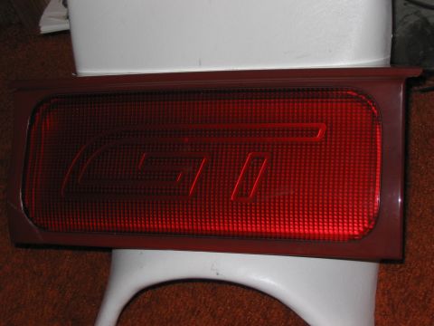 1994 Ford Probe - Red taillight with GT emblem, likely from a sports car.