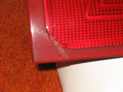 1994 Ford Probe - The corner of a red taillight shows visible cracks and scratches.