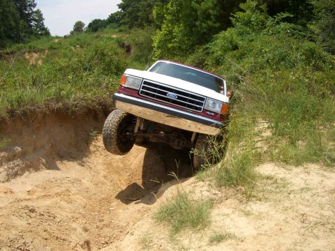 1990 Ford Bronco - This 1990 Ford Bronco navigates a steep dirt incline during an off-road excursion.