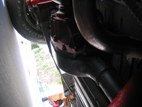 1969 Ford Ranchero - A close-up view of the undercarriage reveals suspension components and exhaust piping, with a watermark indicating 'Supermotors.net'.