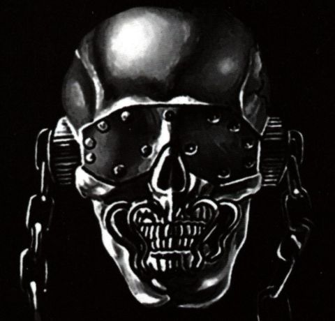 2001 Ford Crown Victoria - A chrome skull mask with chains and goggles is shown against a black background.