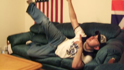 1988 Mercury Sable - Person on a couch with flags in the background.
