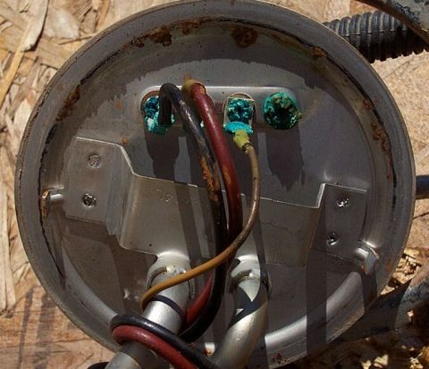 1990 Ford Bronco - This is a close-up view of a fuel pump assembly, showing its electrical connections and fuel lines.