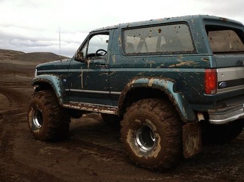 1979 Ford Bronco - This SUV is covered in mud, suggesting it has been driven off-road.