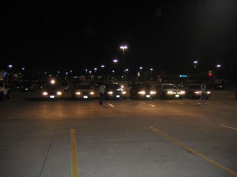 2000 Ford Crown Victoria - A 2000 Ford Crown Victoria is seen from the front at night with its headlights illuminated.