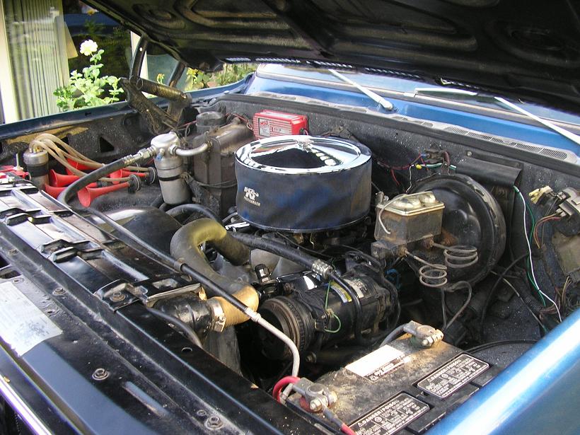 Blue 1979 Chevrolet C/K Pickup engine bay with chrome air cleaner and visible battery