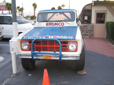 1985 Ford Mustang - This modified Ford Bronco features racing decals and a prominent bull bar on its front end.