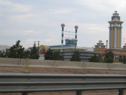 1985 Ford Mustang - The Nevada Landing hotel and casino complex features unique architectural elements and prominent signage.