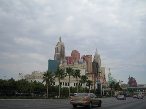 1985 Ford Mustang - A view of the Las Vegas skyline the New York-New York Hotel and Casino with traffic on the highway.