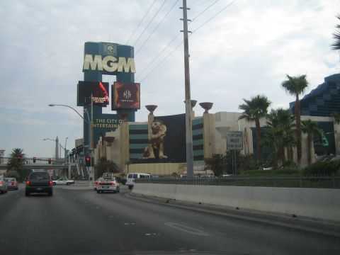 1985 Ford Mustang - A view of the Las Vegas Strip shows the iconic MGM Grand hotel and casino with its prominent signage and lion statue.