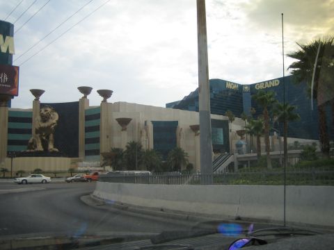 1985 Ford Mustang - The MGM Grand hotel and casino complex in Las Vegas, with a large lion statue visible on the facade.
