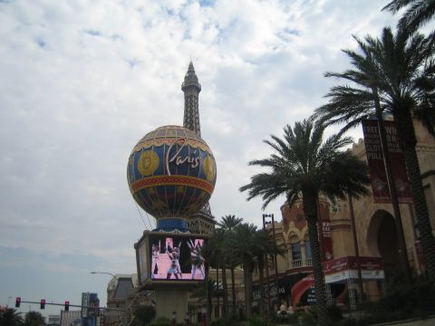 1985 Ford Mustang - The Paris Las Vegas hotel features a replica Eiffel Tower and a large hot air balloon sign.