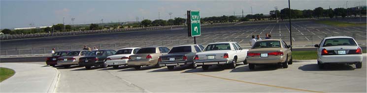 Rear view of a white 1988 Ford Crown Victoria LTD parked in a lot