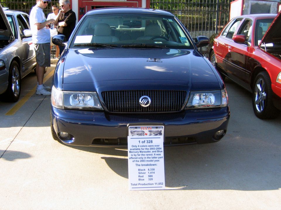 Dark blue Mercury Grand Marquis front view, with a sign detailing production numbers