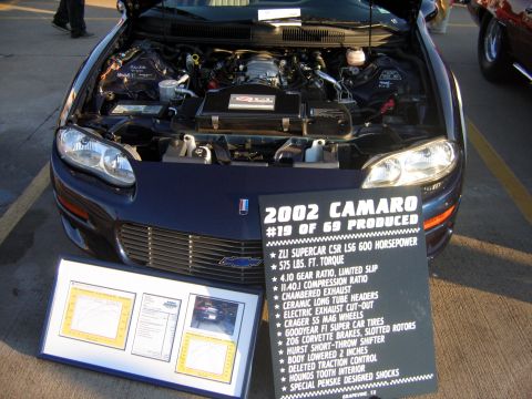 2000 Ford Crown Victoria - A 2002 Chevrolet Camaro ZLI Supercar is shown with its hood open, displaying engine specifications.