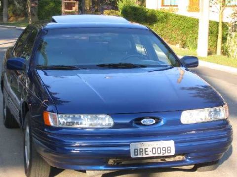1995 Ford Taurus - Front view of a blue 1995 Ford Taurus sedan with a sunroof.