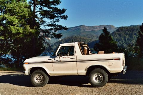 1979 Ford Bronco - Side view of a 1979 Ford Bronco in a scenic mountain setting.