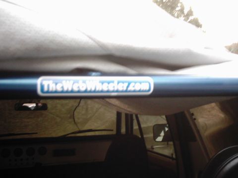 1978 Ford Bronco - Roll cage interior detail with a website sticker.