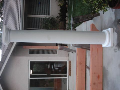 1978 Ford Bronco - Architectural column and lumber are visible in front of a house exterior.