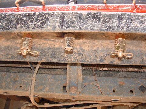1993 Ford Bronco - The underside of a vehicle shows heavy-duty bumper mounting hardware, likely for off-road use.