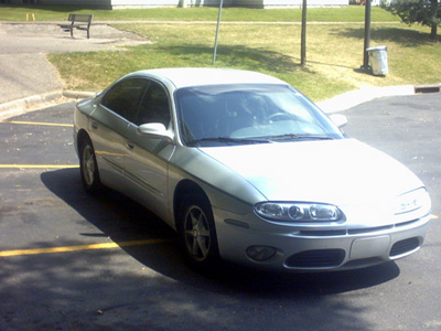 2002 Oldsmobile Aurora - This 2002 Oldsmobile Aurora is captured in a three-quarter front view, parked in an outdoor lot.
