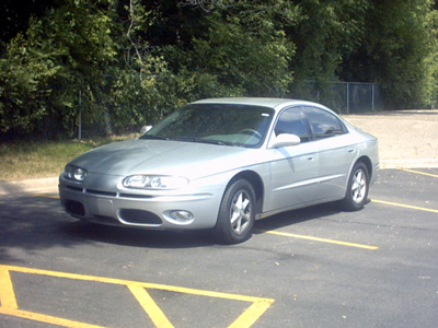 2002 Oldsmobile Aurora - Silver 2002 Oldsmobile Aurora parked in a lot.