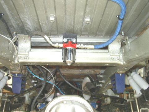 1995 Ford Bronco - Custom fuel filter installation visible from underneath a vehicle.