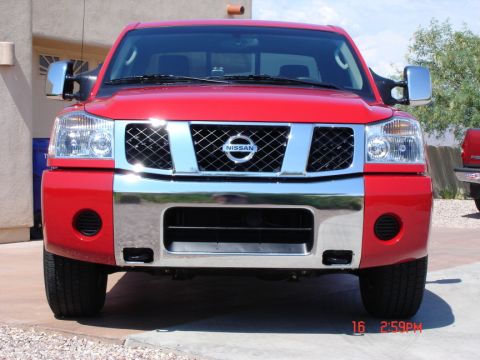 2005 Nissan Titan - Frontal view of a red 2005 Nissan Titan pickup truck.