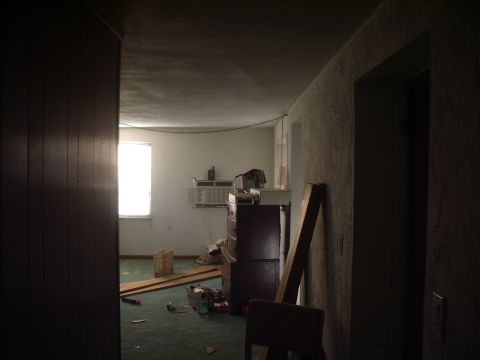 1978 Ford Bronco - This is an interior scene of a room with a window and various items scattered on the floor.