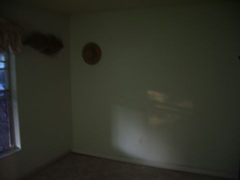 1978 Ford Bronco - A dimly lit room interior shows a window and a wall decoration, with a watermark at the bottom right.