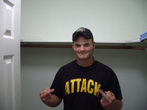 1978 Ford Bronco - Man wearing a black t-shirt with the word ATTACK printed in yellow.
