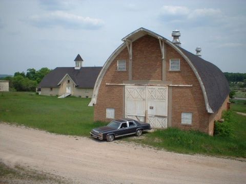 1984 Ford Crown Victoria LTD - In front of one of the barns of the Traverse City State Hospital. The barns were built just prior to the Depression.