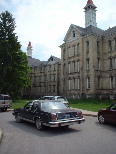 1984 Ford Crown Victoria LTD - In front of Building 50, the main building of the Traverse City State Hospital.